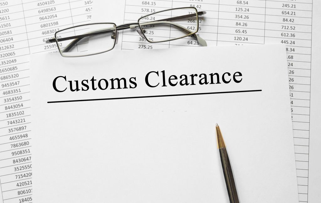 Paper with Customs Clearance on a table